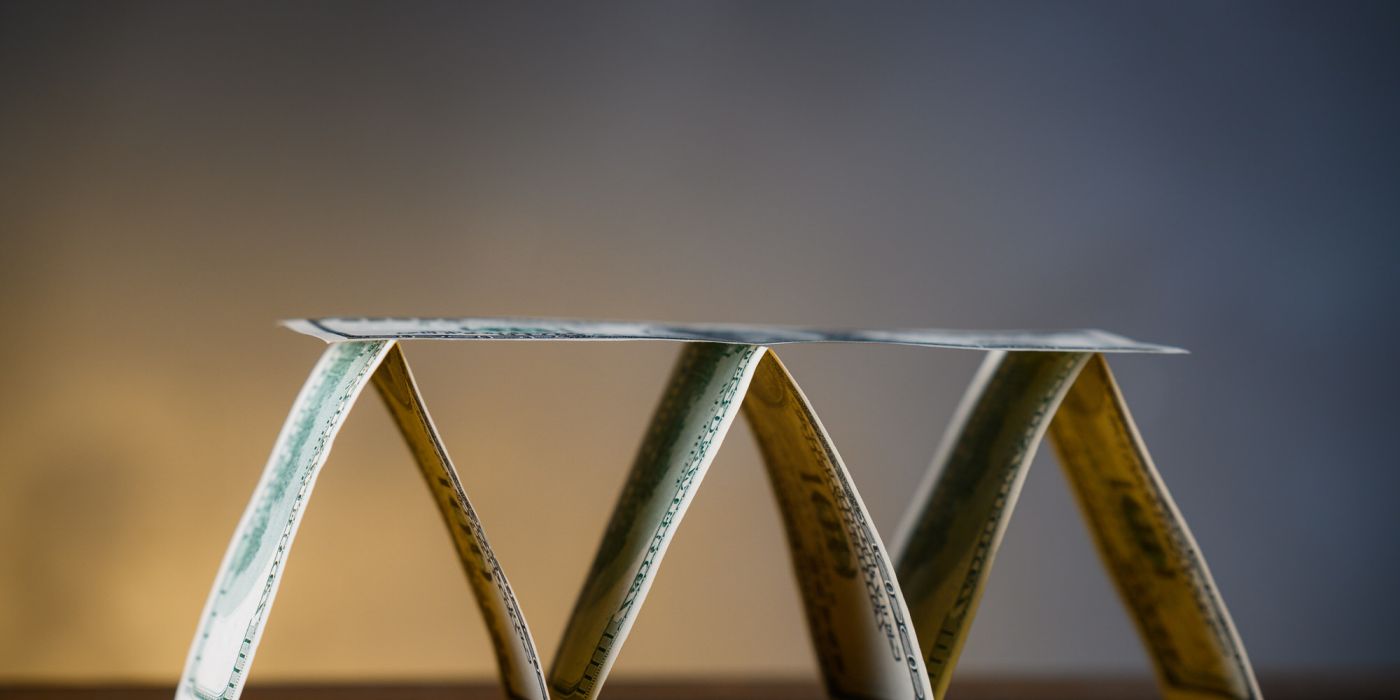 base of pyramid with dollar bills